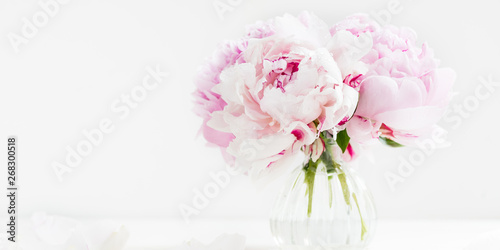 Fototapeta Naklejka Na Ścianę i Meble -  Fresh bunch of pink peonies on light background. Card Concept, copy space for text