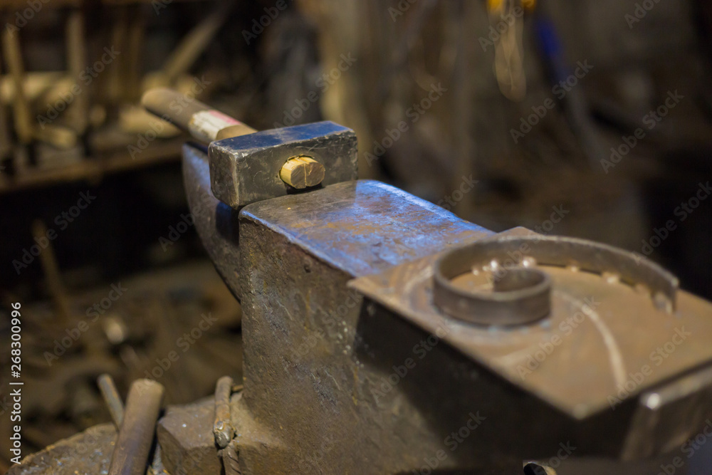 Blacksmith hammer and anvil at forge, workshop. Handmade, craftsmanship and blacksmithing concept