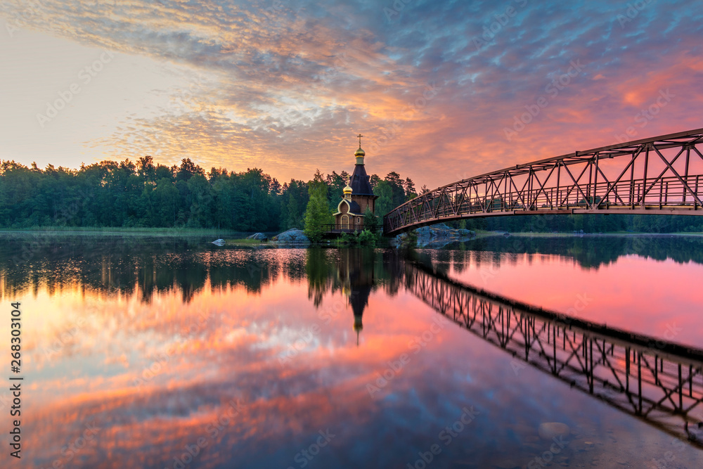 Church of Andrew on the River Vuoksa. Beautiful summer sunrise. Leningrad Oblast, Russia