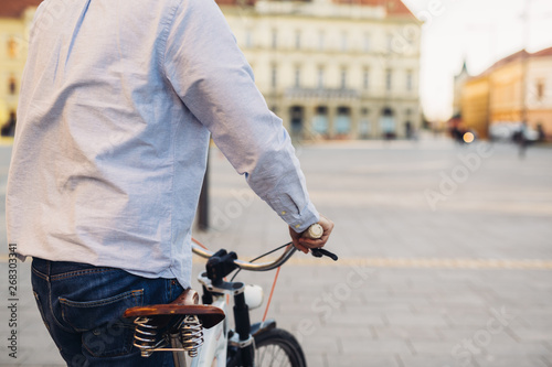 middle aged man riding bike on street outdoor