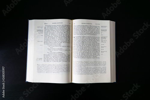Flat lay open Bible, Greek New Testament. Novum Testamentum Graece. On black background. Baselland, Switzerland 12.05.2019
