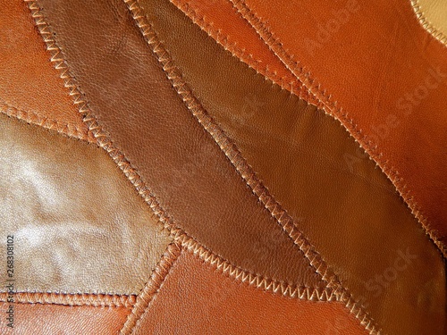 Genuine leather background. Pieces of leather of different shades.