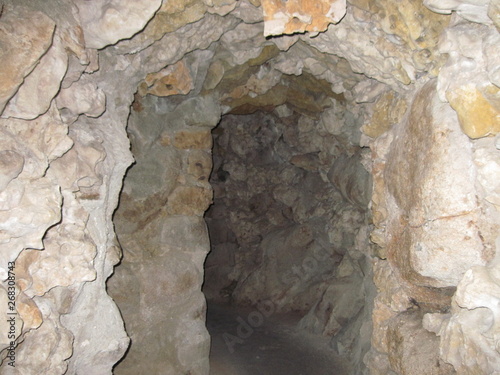 View of the aged path to the well of nine circles of hell in Quinta da Regaleira Park in Sintra, Portugal.