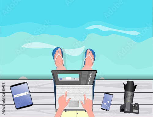 Freelance concept. Freelancer-photographer-illustrator-stocker working with laptop near the sea