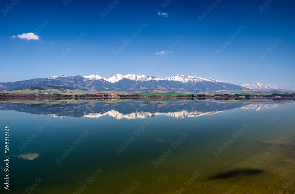 Reflection of Tatra mountans in lake Liptovska Mara, Slovakia Reflection of Tatra mountans in lake Liptovska Mara, Slovakia