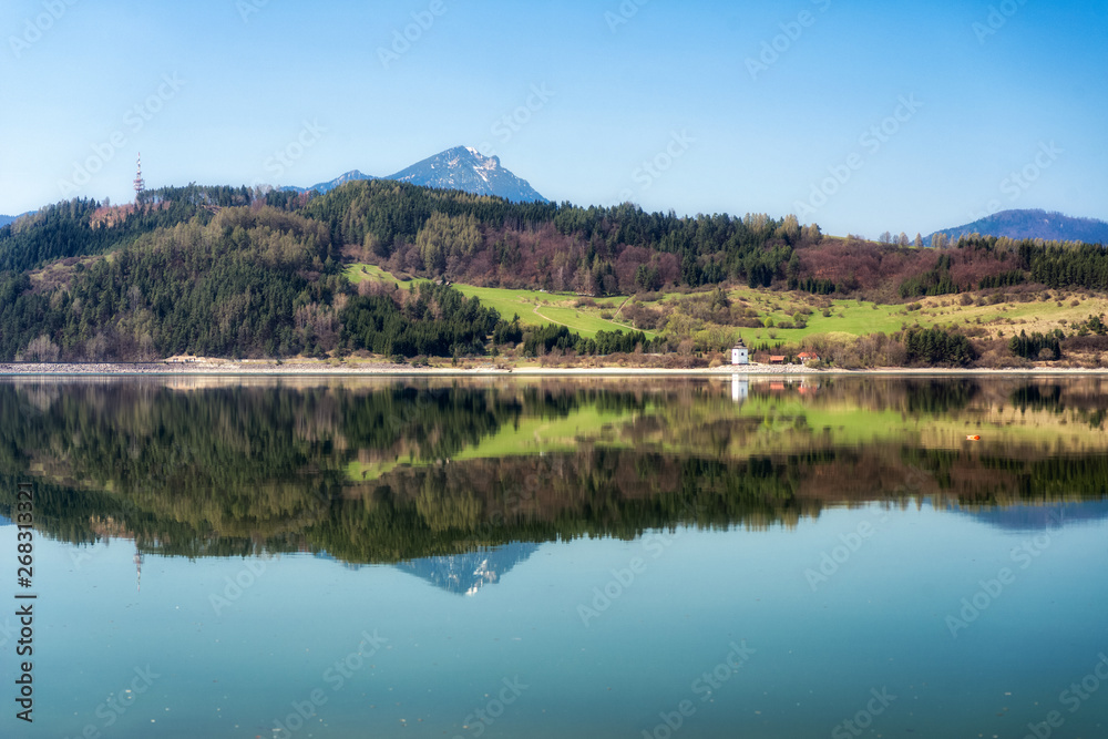 Reflection of hill Choč in lake Liptovska Mara, Slovakia