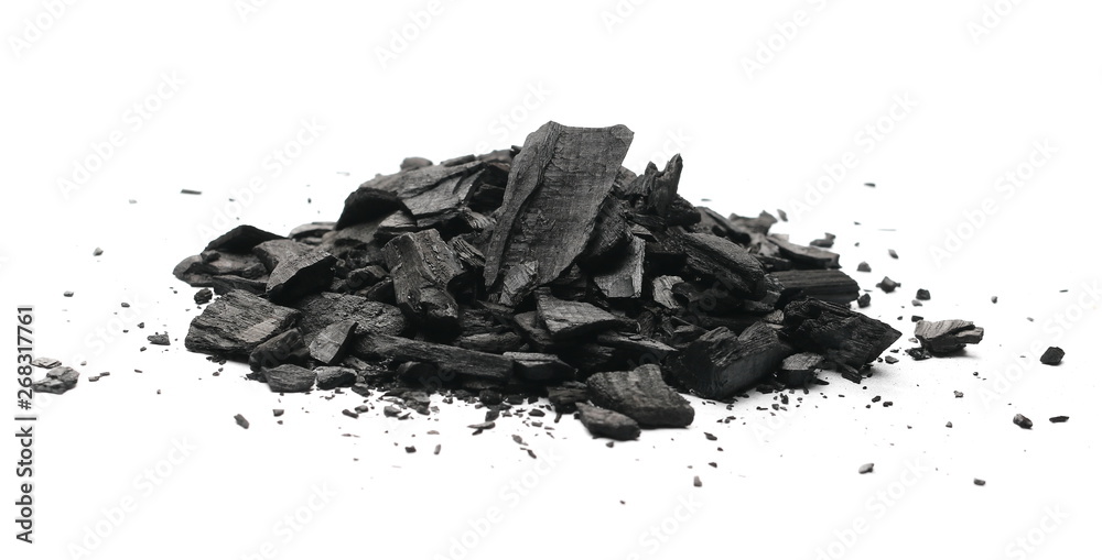 Black charcoal chunks, pile isolated on white background