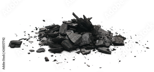 Black charcoal chunks  pile isolated on white background