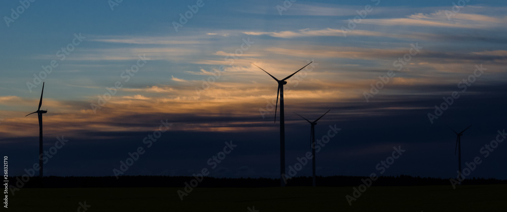 WIND TURBINE - Sunrise over a wind farm