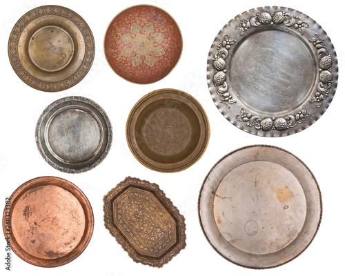 Antique metal painted plates isolated on white background. Retro style. Vintage.