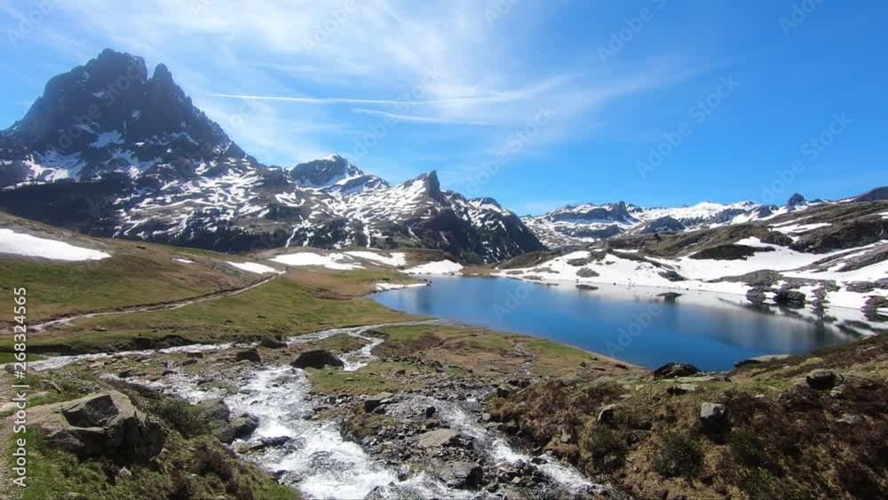 view of Pic du Midi Ossau in the french Pyrenees with a waterfall