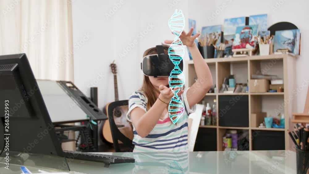 Cute teenager girl wearing a VR headset learning about DNA based on a 3D holographic projection in front of her. The future of education and learning