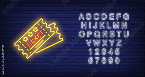 Tickets neon icon. Cards shape with stars and Ticket lettering on brick wall background. Performance concept. Vector illustration can be used for neon signs, advertising, show invitation