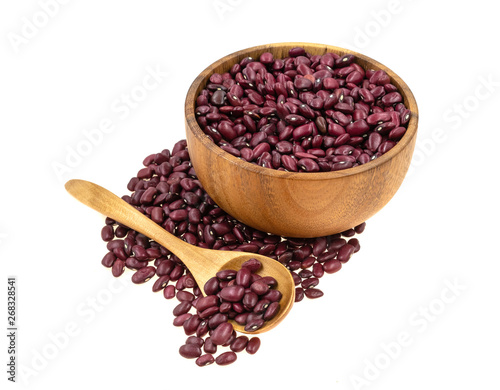 Red beans in a wooden dishes with a spoon isolated on white background