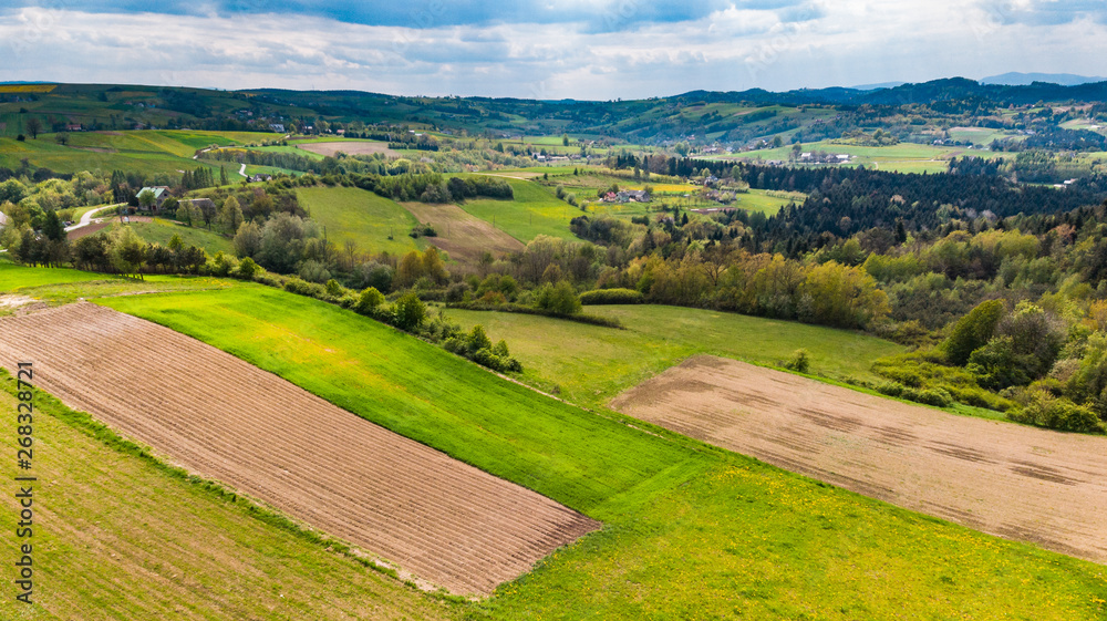 Farmlands and mountains in rural Poland seen from drone