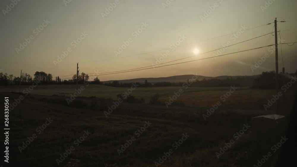 Farms, fields, landscapes and a small city seen from a sightseeing train - panoramic view. Farms, fields, landscapes and a small city seen from a sightseeing train - panoramic view.