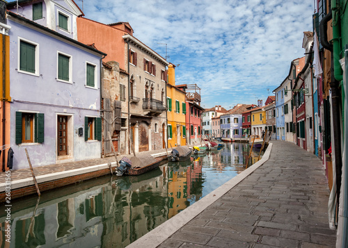 famous colorful houses on the island of Burano in the Venetian lagoon, Italy. © zenzaetr