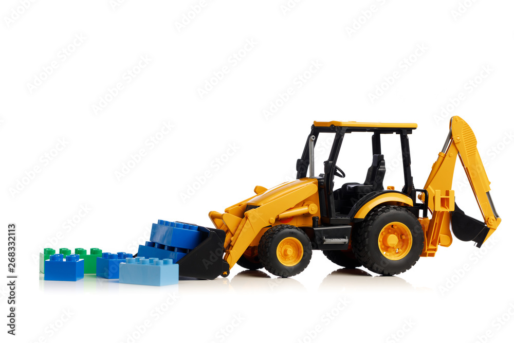 backhoe tractor with brick toys, white background