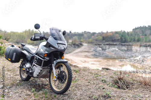 Adventure Motorbike. Off road. Motorcycle trip. enduro Traveling, Lifestyle Travel dual sport outdoor concept. clothing with protection, copy space, dirt, plastic side bags