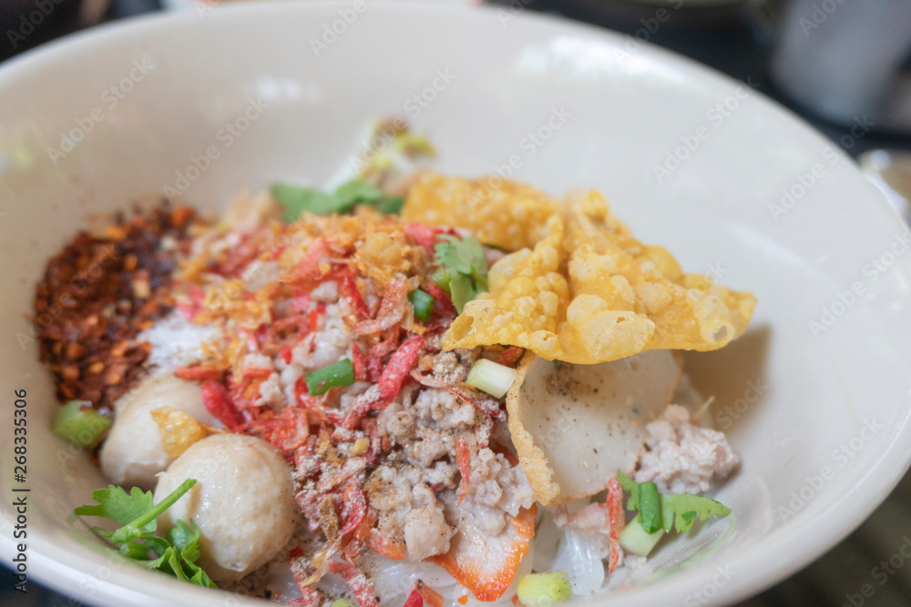 Noodle tom yum with pork and egg . Noodle tom yum with pork and egg .