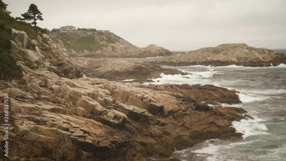 Static shot of the ocean and waves hitting the rocks at the coast of Nova Scotia, Canada - slow motion. Static shot of the ocean and waves hitting the rocks at the coast of Nova Scotia, Canada - slow motion.