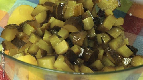 Chopped Pickles Dropped Into Bowl