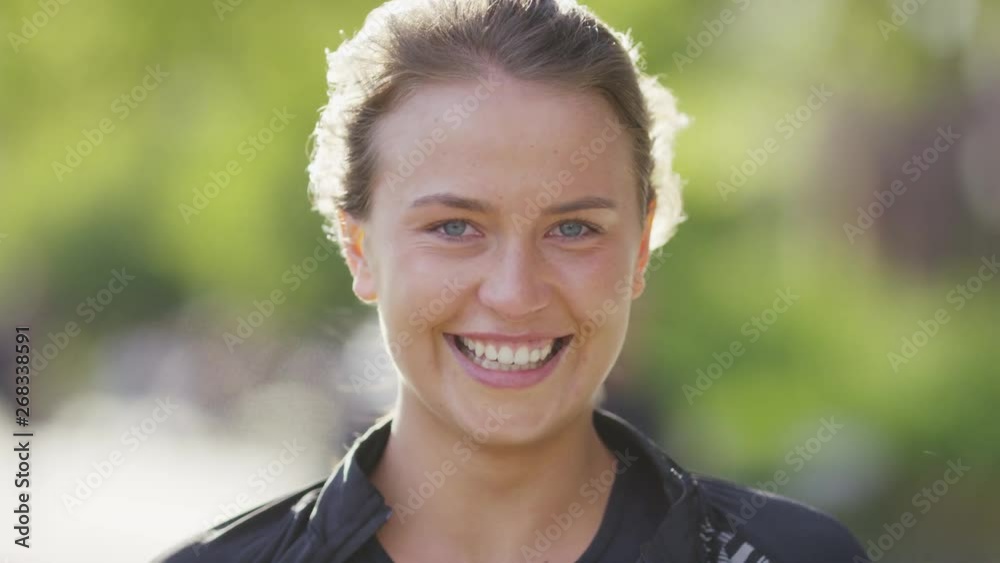 Portrait of young female looking and smiling to camera Portrait of young female looking and smiling to camera