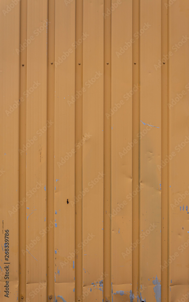 Fototapeta premium Old Weathered Brownish Vertically Stripped Metal Panels