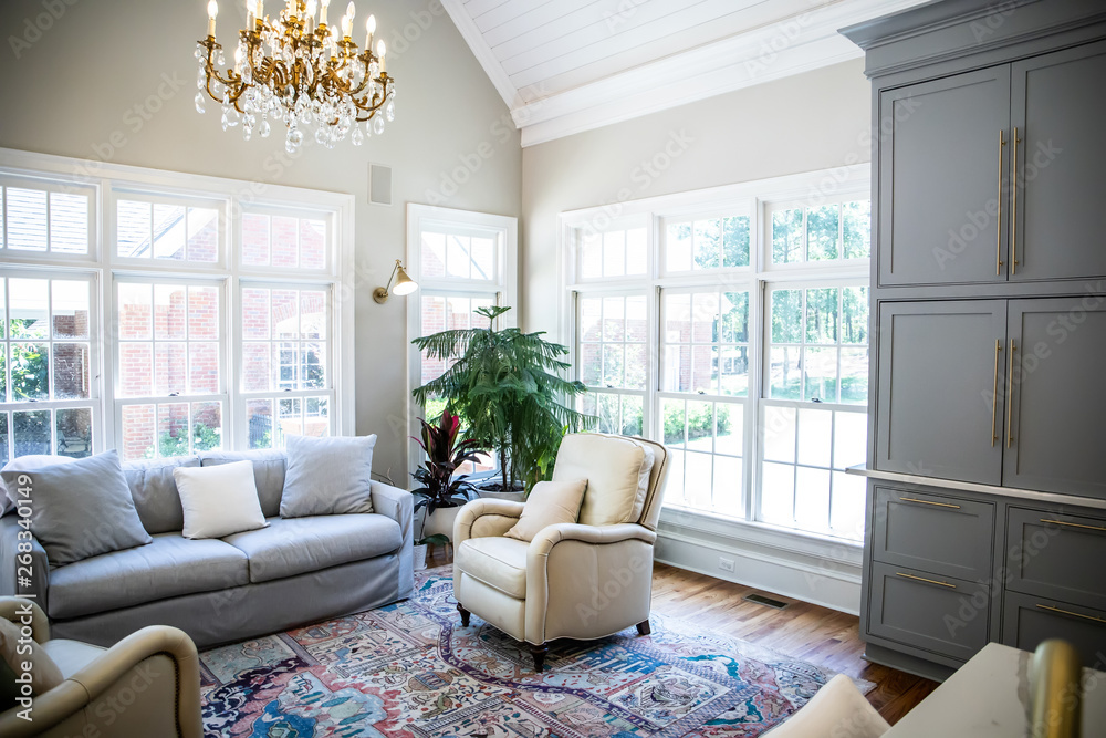 Fototapeta premium Open Concept Living Room Den with Vaulted Ceilings and Lots of Windows with a Neutral color palette
