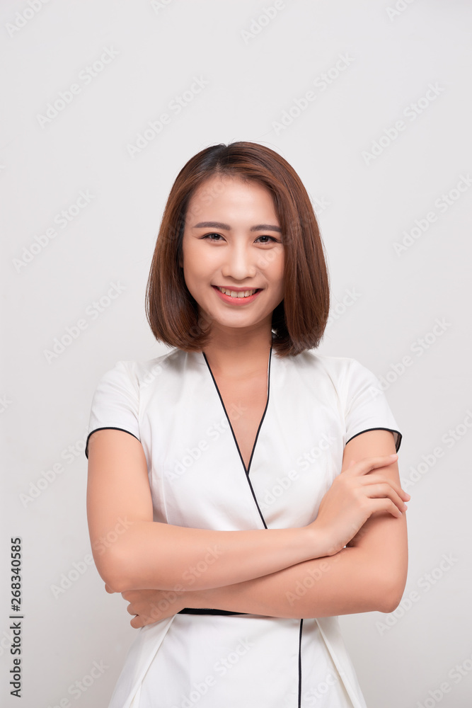 Smiling asian business woman on white background