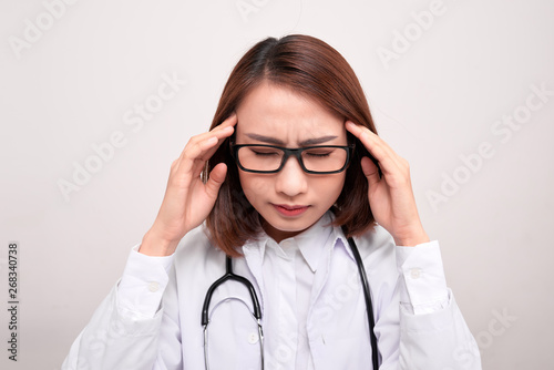medical doctor woman with stethoscope problem, hold hand head on white background