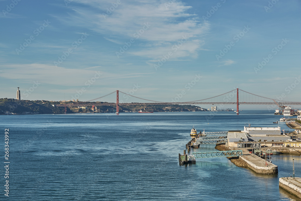 Fototapeta premium The 25 April bridge (Ponte 25 de Abril) is a steel suspension bridge located in Lisbon, Portugal, crossing the Tagus river. It is one of the most famous landmarks of the region