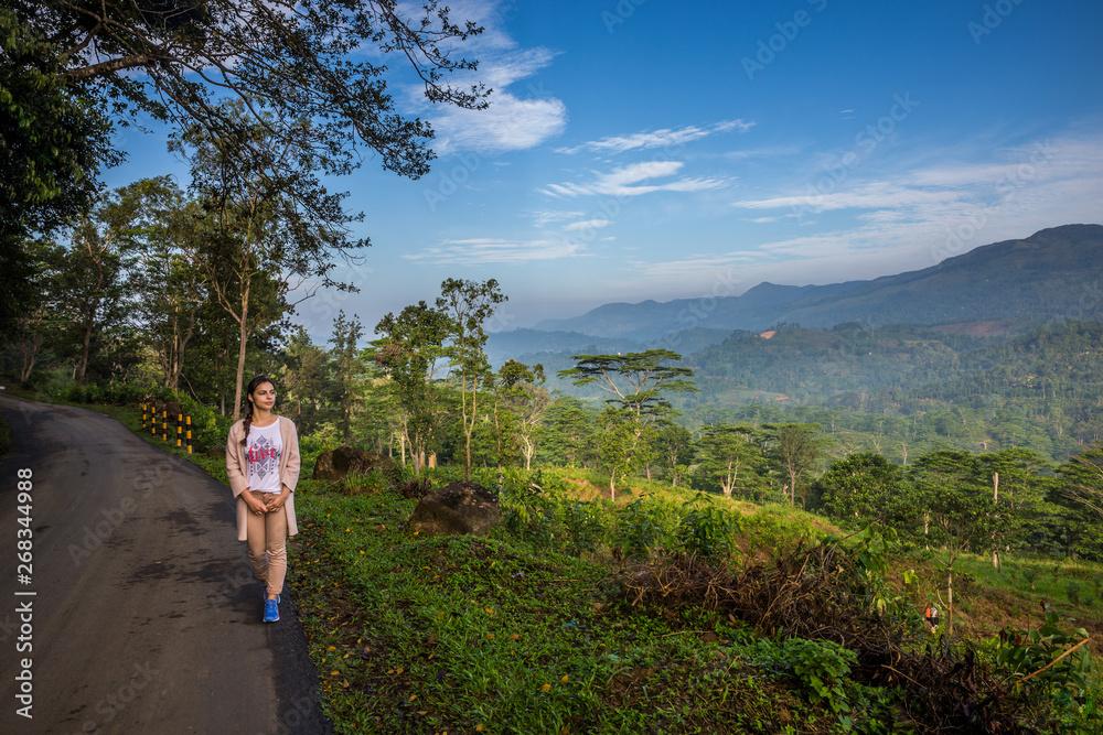 Beauty of wild nature. Magnificent view. Young girl walking early in the morning.