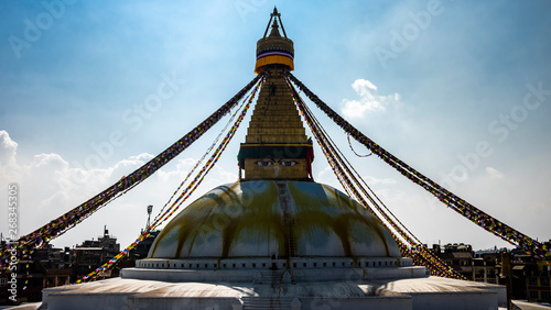 Boudhanath is a stupa in Kathmandu, Nepal. Located about 11 km from the center and northeastern outskirts of Kathmandu, the stupa's massive mandala makes it one of the largest spherical stupas in Nepa