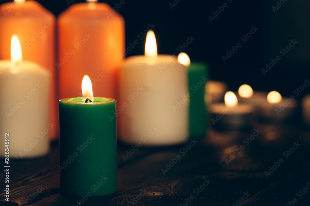 candles burning in darkness over black background. commemoration concept. candles burning in darkness over black background. commemoration concept.