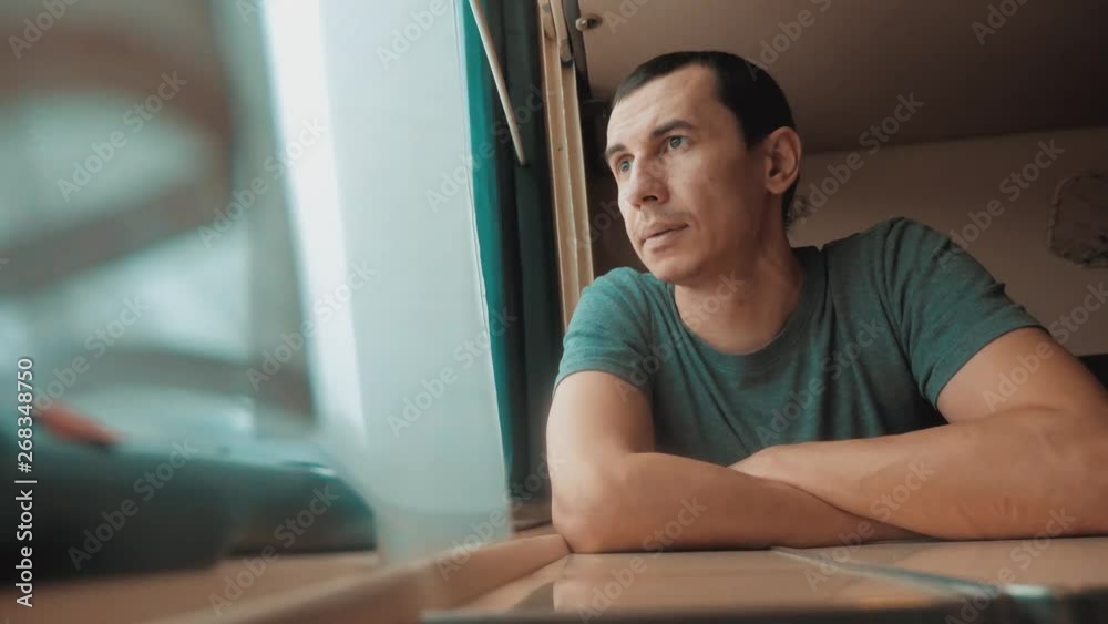 man travel rides train railway looks lifestyle out the window. traveler concept train railroad journey travel. slow motion video. beautiful from window of a moving train railway trip Russia winter man travel rides train railway looks lifestyle out the window. traveler concept train railroad journey travel. slow motion video. beautiful from window of a moving train railway trip Russia winter