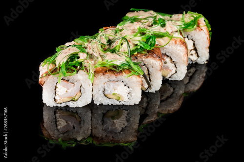 Sushi Roll - Maki Sushi pieces collection with Salmon Roe, Smoked Eel, Cucumber, Cream Cheese, Sesame, Avocado, Onion Fries, Crab Meat, Tobiko isolated on black background - Image