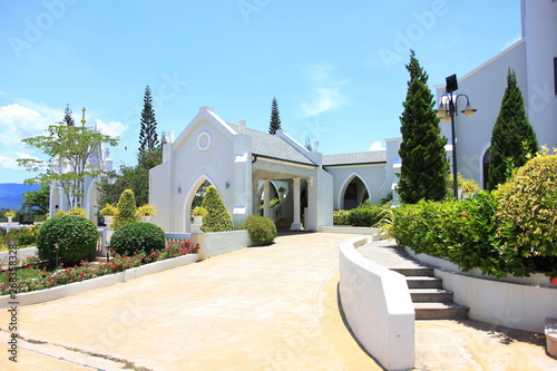 Nakhon Ratchasima, Thailand - May 10, 2019: Outdoor around the church of the Blessed Nicholas Bunkerd Kitbamrung Church Through the Archways in Khao Yai. photo