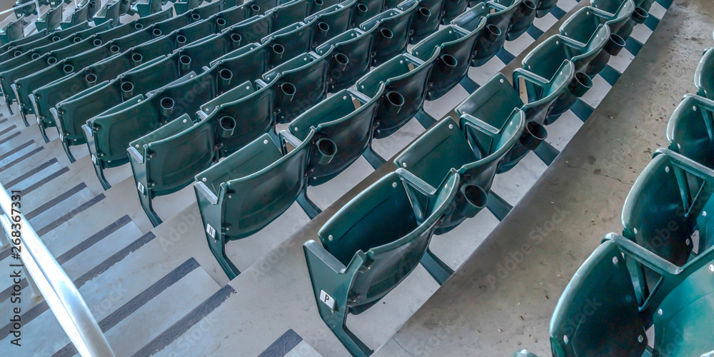 Fototapeta premium Panorama Tiered seating and viewing rooms on a baseball field viewed on a sunny day