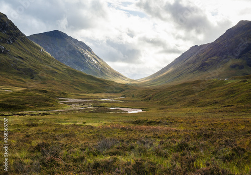 The Pass of Glen Coe in the Scottisch Highlands under a dramatic sky photo