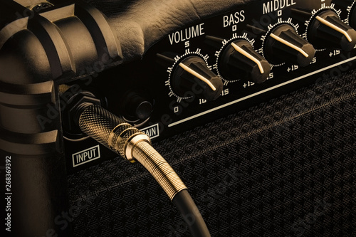 Guitar amplifier with jack plugged in. Close up macro view photo