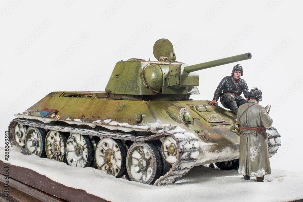 Soviet tank T 34 76 production UVZ, during the Second world war, the crew gets the job. The time period in the winter of 1942. Diorama in modeling, made by the author of the photo.