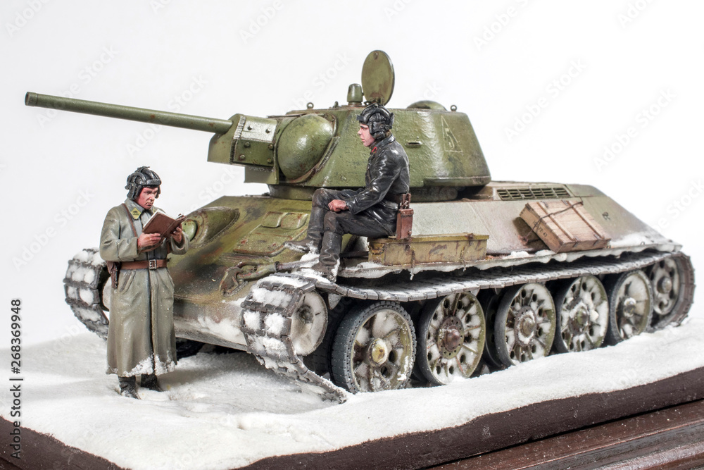 Soviet tank T 34 76 production UVZ, during the Second world war, the crew gets the job. The time period in the winter of 1942. Diorama in modeling, made by the author of the photo.