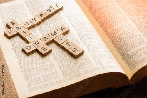 words created like a crossword puzzle with wooden letter lites photo