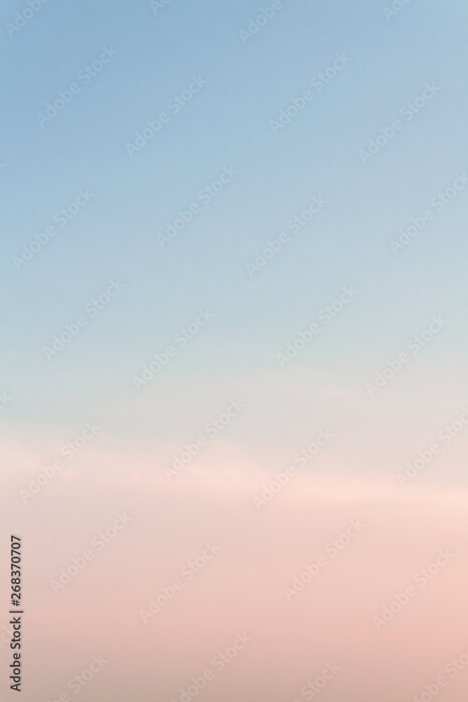 Beautiful sunset sky with feathery pink clouds in spring