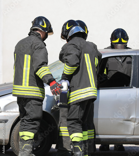 fire brigade opens the door of the car with a powerful shear aft