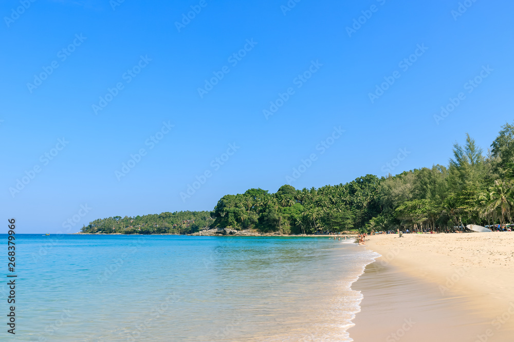 Crystal clear turquoise blue Andaman sea at Surin Beach, Phuket, Thailand