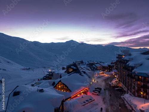Snowy Val Thorens ski station and town during purple sunset