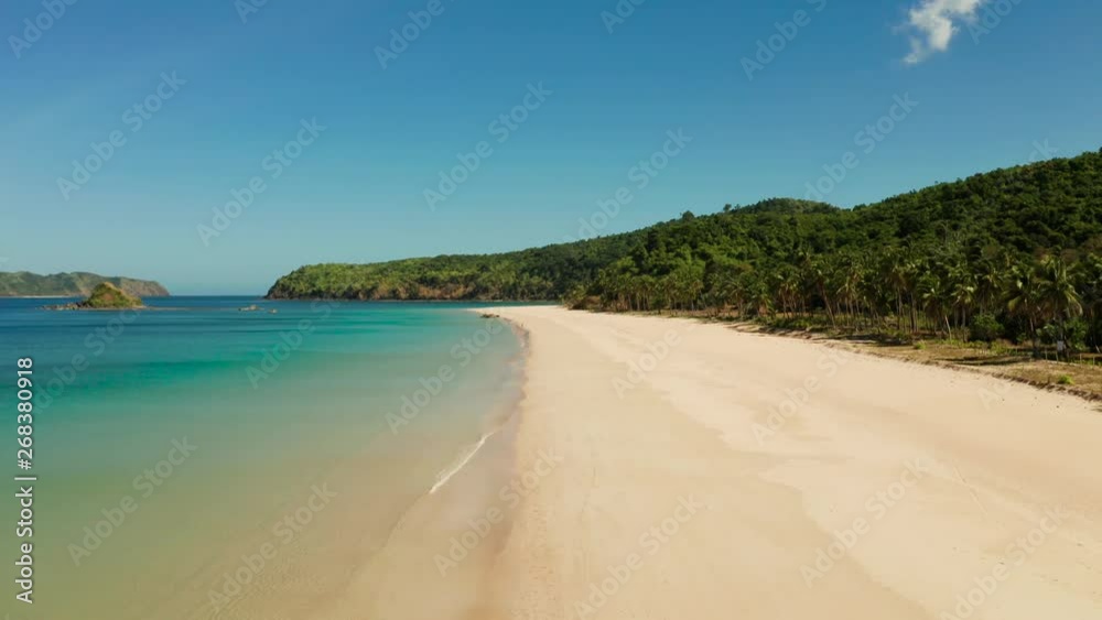 Aerial drone of tropical sandy beach and blue water. Nacpan, El Nido, Palawan, Philippines. Seascape with tropical beach and islands. Summer and travel vacation concept Aerial drone of tropical sandy beach and blue water. Nacpan, El Nido, Palawan, Philippines. Seascape with tropical beach and islands. Summer and travel vacation concept