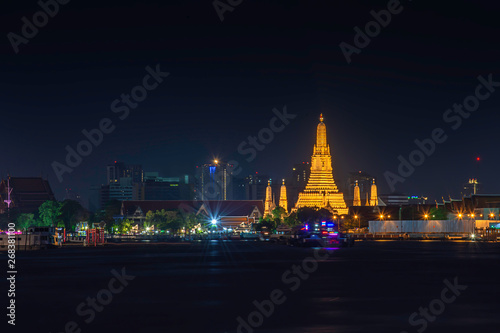 Wat Arun at night with gold and is the oldest temple of the Chao Phraya River. in Bangkok Thailand.